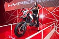 Ragazza e Ducati Hypermotard alla 70^ edizione dell´Eicma 2012 di Milano
