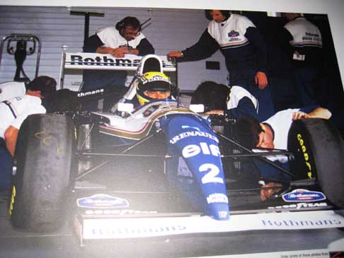 20 anni dalla scomparsa di Senna - Monoposto Renault Rothmans con il pilota Ayrton Senna in una mostra fotografica ad Imola width=